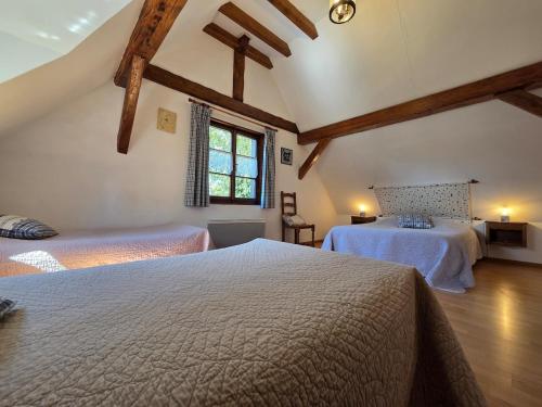 Ένα ή περισσότερα κρεβάτια σε δωμάτιο στο Gîte de charme Alsacien près de Colmar