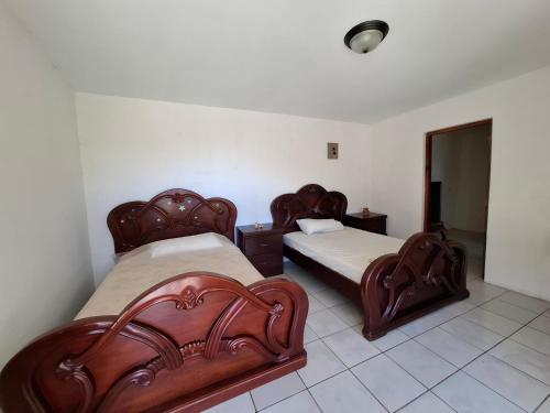 Postel nebo postele na pokoji v ubytování Noatun House