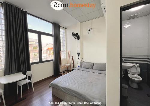 Giường trong phòng chung tại DeMi Homestay 2 - Châu Đốc