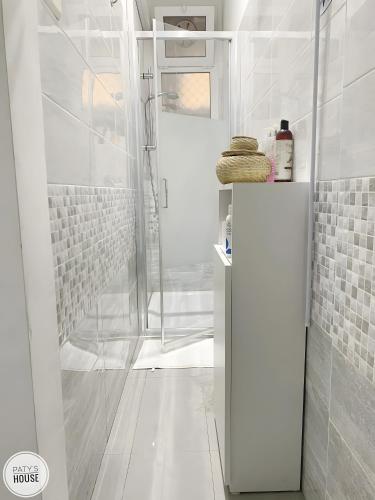 a bathroom with a shower with a glass door at Paty's House Milano in Milan
