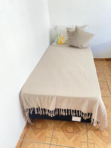 Giường trong phòng chung tại Casa aconchegante