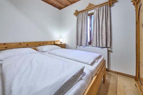 Postel nebo postele na pokoji v ubytování Haus Erni