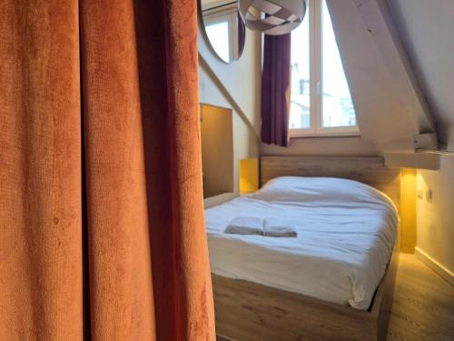 Postel nebo postele na pokoji v ubytování Romains - Bel appartement à Reims