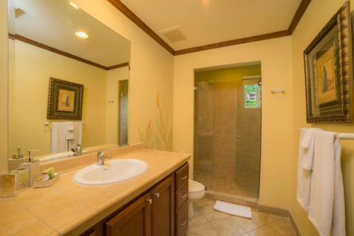 a bathroom with a sink and a shower at Veranda 1B 3 bdr Golf Course View in Los Suenos in Herradura