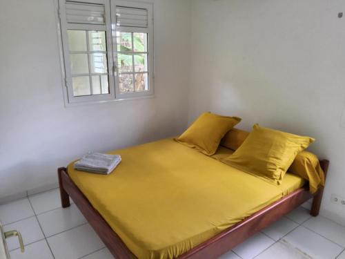 Ένα ή περισσότερα κρεβάτια σε δωμάτιο στο Les terrasses de Maëlle II