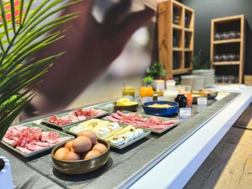 a buffet with different types of food on a table at ibis Nîmes Ouest - A9 in Nîmes