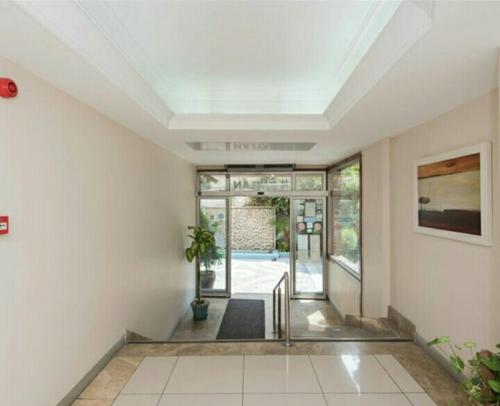 an empty hallway with a staircase in a house at Hotel Baylan İzmir in Izmir