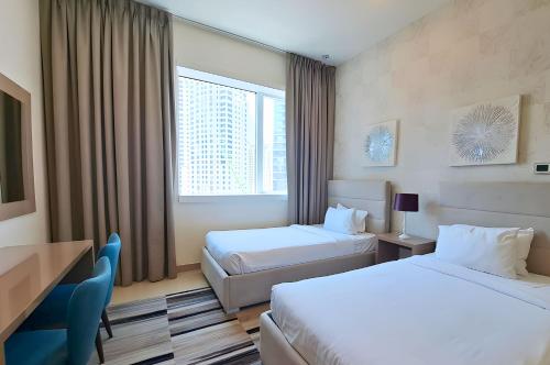 Кровать или кровати в номере Barceló Residences Dubai Marina