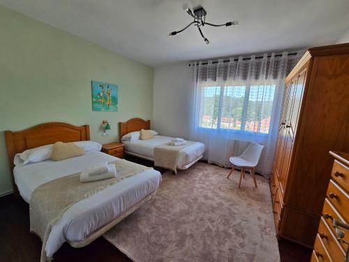 En eller flere senge i et værelse på Welcome A Casa de Pepe eLola