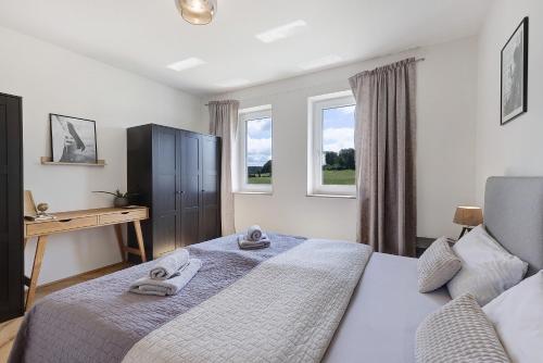 Ένα ή περισσότερα κρεβάτια σε δωμάτιο στο am Rande des Biosphärengebiets