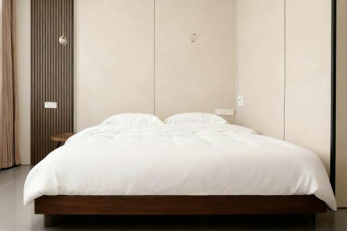 Ένα ή περισσότερα κρεβάτια σε δωμάτιο στο Platinum Selection Hotel 7x24Airport pick-up and drop-off