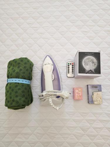 a purse and other items on a bed at 어반 팀버 수원 in Hagwanggyo-dong