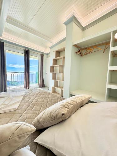 Postel nebo postele na pokoji v ubytování Hera House, Ponta do Sol, Portugal