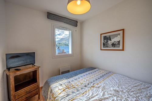 Ένα ή περισσότερα κρεβάτια σε δωμάτιο στο Le calme de Ax