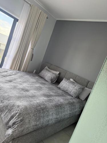 Ένα ή περισσότερα κρεβάτια σε δωμάτιο στο 2 Bedroom 2 Bathroom Executive Suite