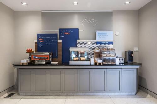 a counter with a bunch of boxes on it at Holiday Inn Express Calgary South by IHG in Calgary