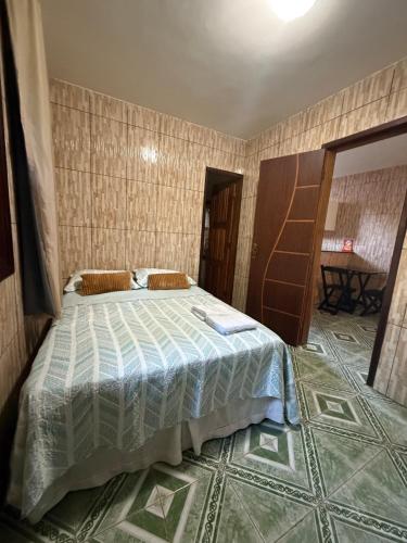 Postel nebo postele na pokoji v ubytování Chalés da Poliana