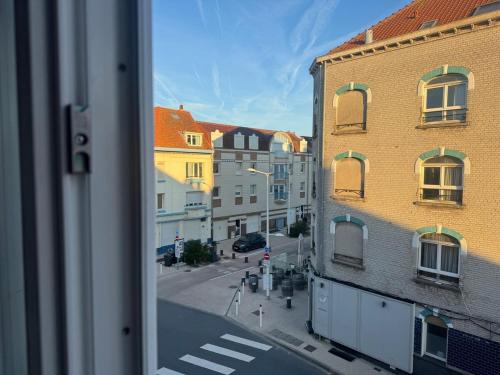a view of a city street from a window at Digue & Dream - 4-person apartment in Dunkerque