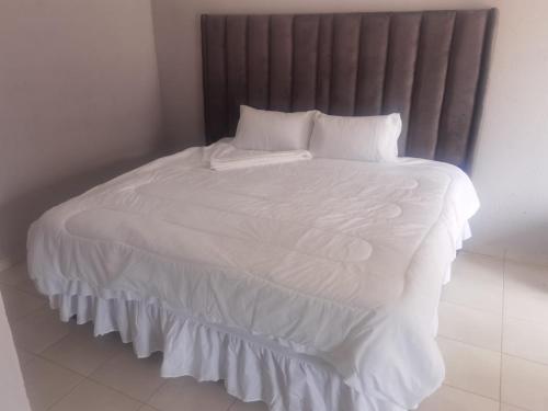 Ένα ή περισσότερα κρεβάτια σε δωμάτιο στο Magoveni Accommodation