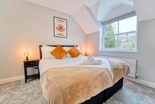 a bedroom with a bed with a teddy bear on it at 3 Bed House with Office Space in Coventry, by ARP Homes, Central, Driveway & Garage, Garden, Ideal for Contractors, Families & Long stays in Coventry