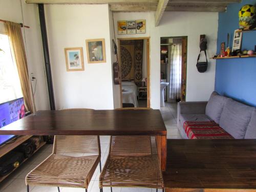 a living room with a table and a couch at La Maruja de Acantilados in Mar del Plata