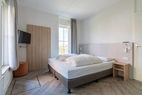 En eller flere senge i et værelse på Kaapsduun 02