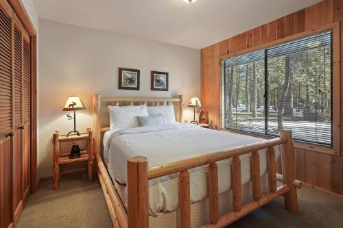 a bedroom with a bed and a large window at 14 Mt Hood in Sunriver