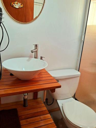 a bathroom with a sink and a toilet at Cabañas Frange 2 in Puerto Natales