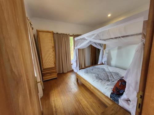 Postel nebo postele na pokoji v ubytování Hondo Hondo mountain view