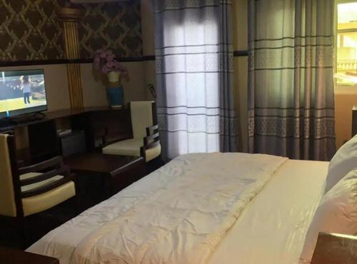 Postel nebo postele na pokoji v ubytování NBS Hotel