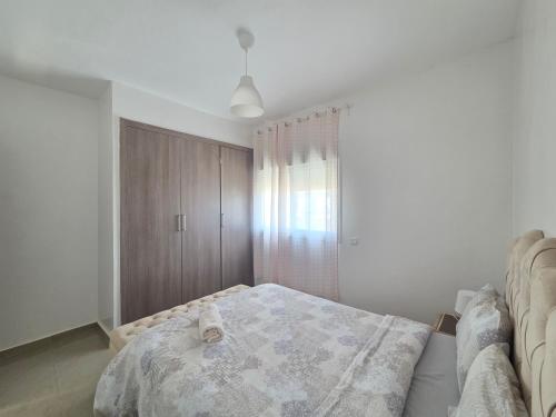 Postel nebo postele na pokoji v ubytování Superbe appartement avec une vue panoramique sur piscine