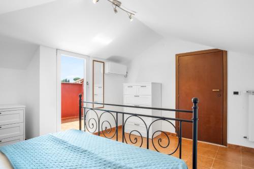 En eller flere senge i et værelse på GardenHouse Frascati