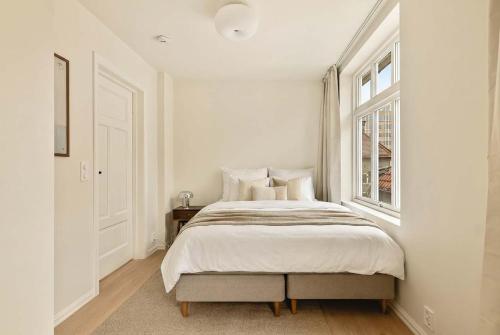 Ένα ή περισσότερα κρεβάτια σε δωμάτιο στο Modern 1BR in heart of old town