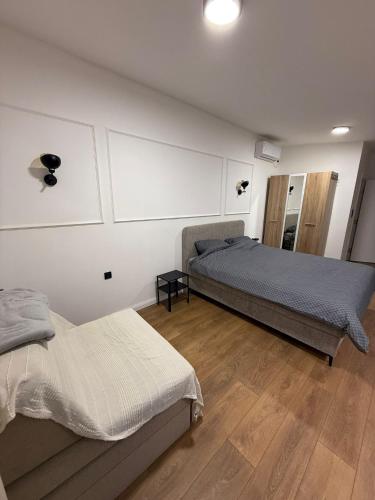 Una cama o camas en una habitación de Povetarac