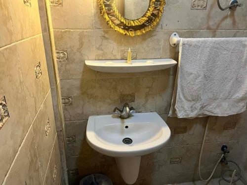 a bathroom with a sink and a mirror at Bait Alaqaba dive center & resort in Aqaba