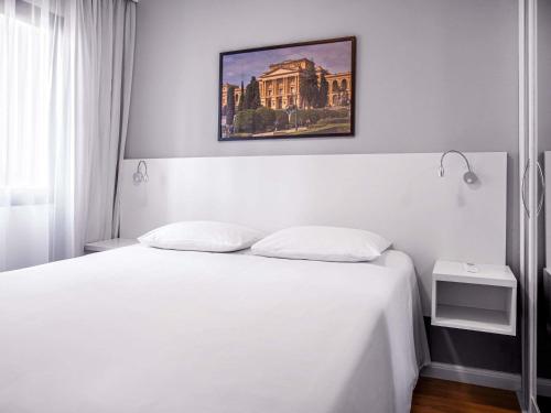 Postel nebo postele na pokoji v ubytování Mercure Sao Paulo Berrini