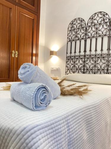 Postel nebo postele na pokoji v ubytování La Casa de Ángela