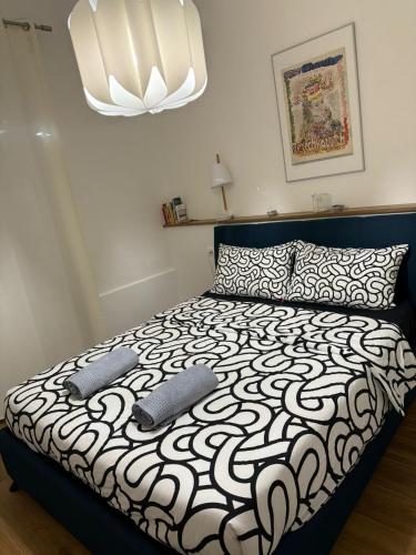 a bedroom with a bed with two pillows on it at Appartamento Betta in Borgo in Gorizia