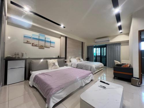 Ένα ή περισσότερα κρεβάτια σε δωμάτιο στο 鹿港春天Spring B&B