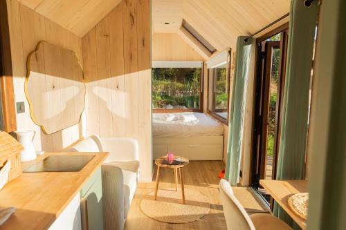 Et opholdsområde på Tiny houses PAMPA Lodges - étang & bain nordique