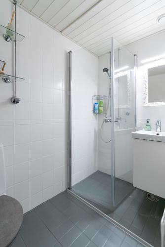 a bathroom with a shower and a sink at City Pearl in Jyväskylä