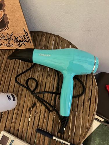 a blue umbrella sitting on top of a table at Aisha guesthouse in Aswan