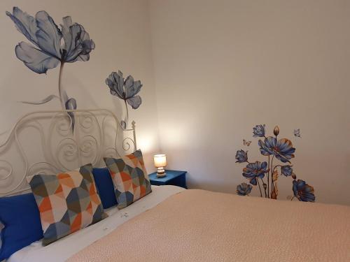 Ένα ή περισσότερα κρεβάτια σε δωμάτιο στο Fiori e Frutti Guest Home