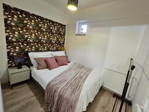 En eller flere senge i et værelse på Anna Vendégház