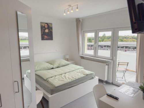 Ένα ή περισσότερα κρεβάτια σε δωμάτιο στο Durdi Hotels Groß-Zimmern 24h Self-CheckIn