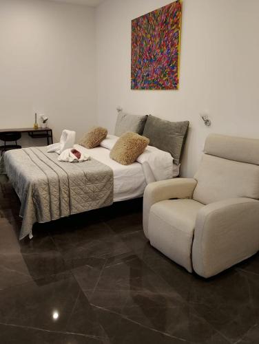 Ένα ή περισσότερα κρεβάτια σε δωμάτιο στο Onda di mare