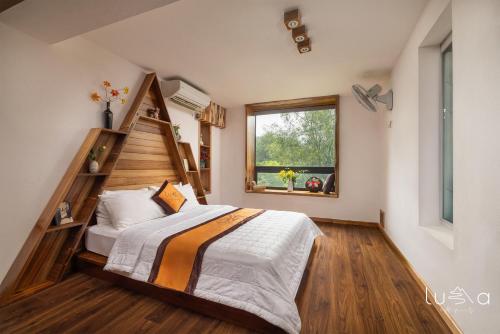 Ένα ή περισσότερα κρεβάτια σε δωμάτιο στο LUMA House