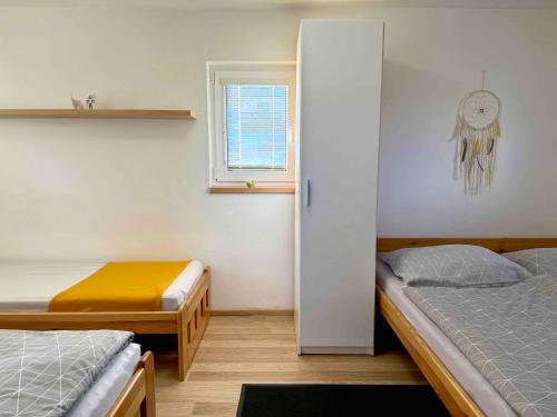 Postel nebo postele na pokoji v ubytování Ubytování Koliba pod Stolovou