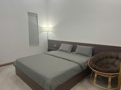 Giường trong phòng chung tại Khách sạn grace hotel dakmil