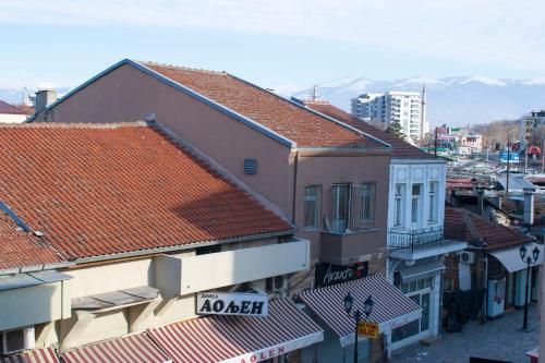 an overhead view of roofs of buildings in a city at Hotel In the heart of Old Bazaar with private parking in Skopje
